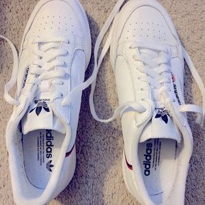 Women’s Adidas sneakers, 9.5. Good condition. White with navy & red accents.